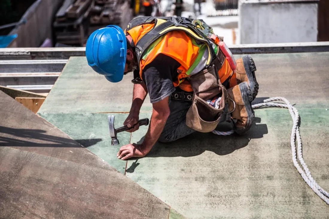 A roofer at work on a roof